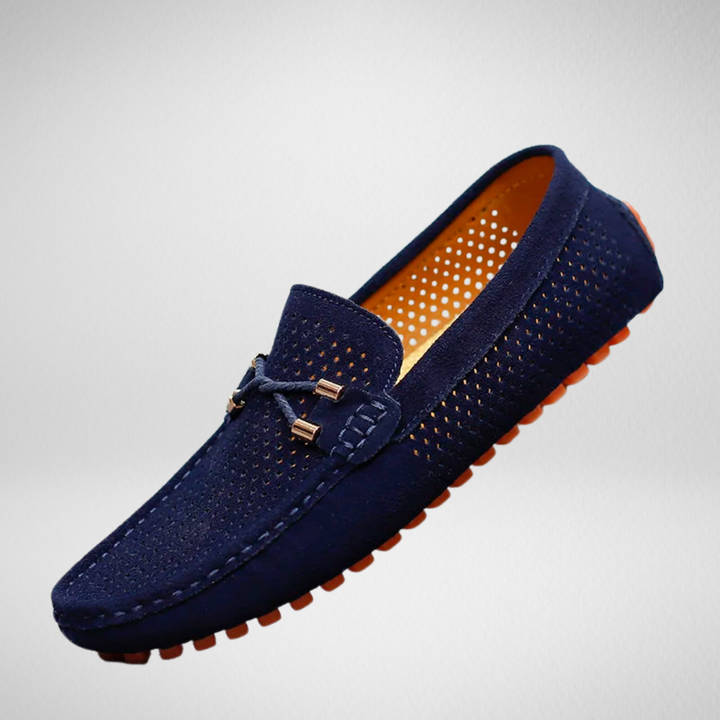 Navy suede perforated driving loafers with orange rubber pebbled sole