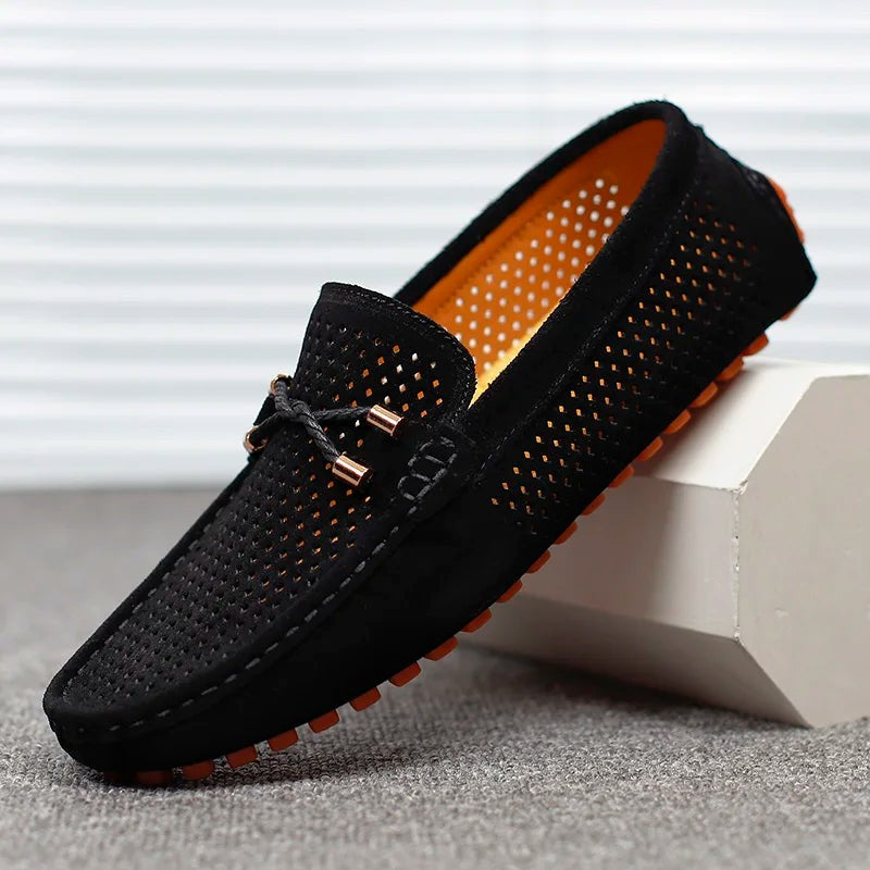 Black suede perforated loafers with tasselled lace and orange sole detail