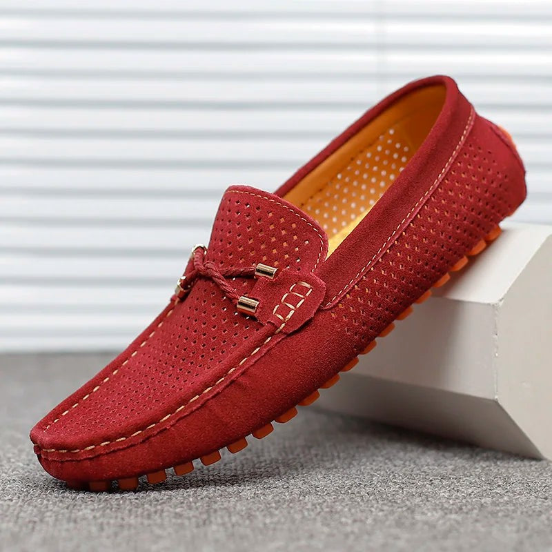Burgundy suede perforated loafers featuring tasselled tie and orange sole