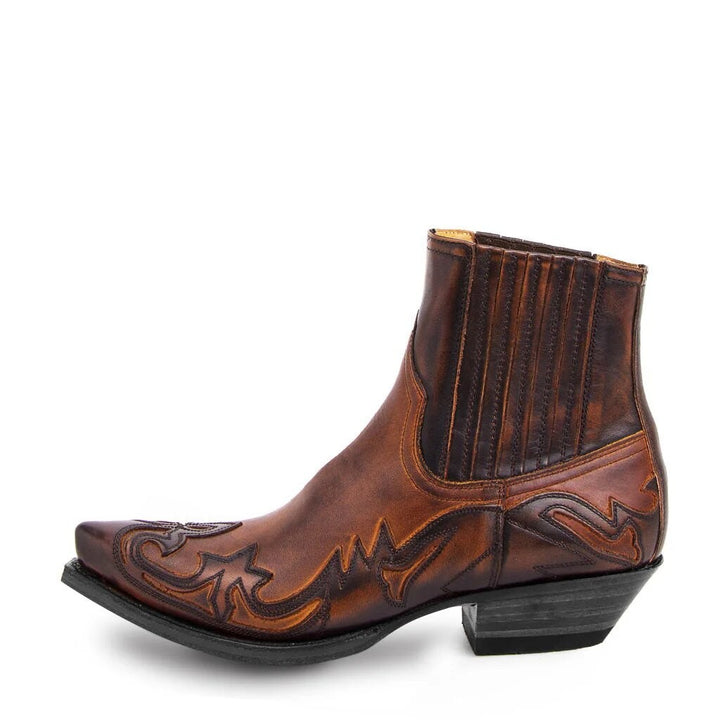 Brown leather western ankle boot showcasing pointed toe and contrast stitching