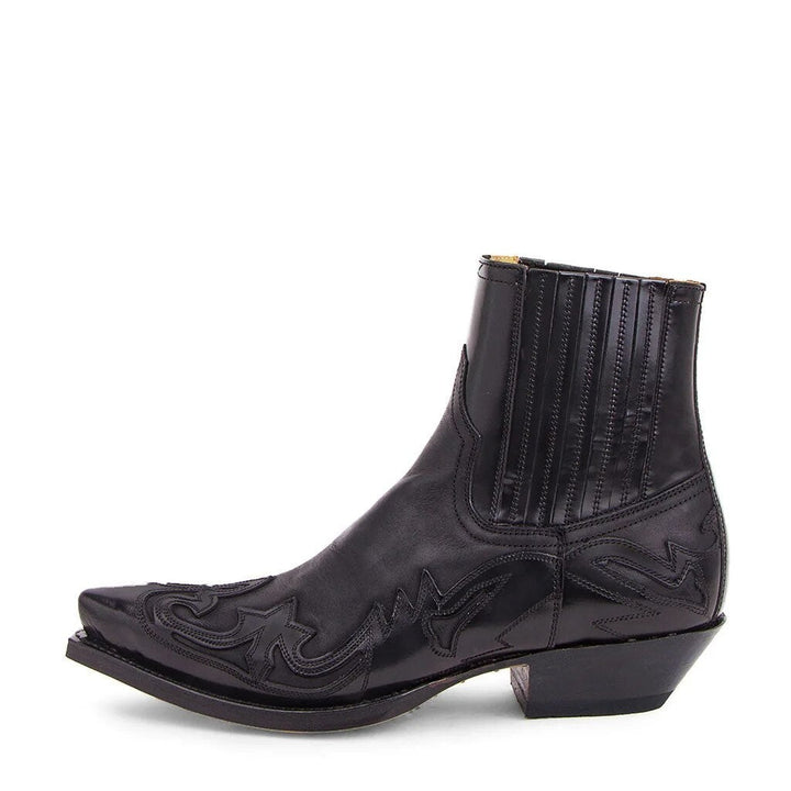 Black leather Chelsea-style cowboy boot with pointed toe and western stitching