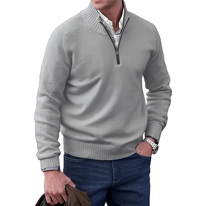 Light grey quarter-zip sweater layered over collared shirt