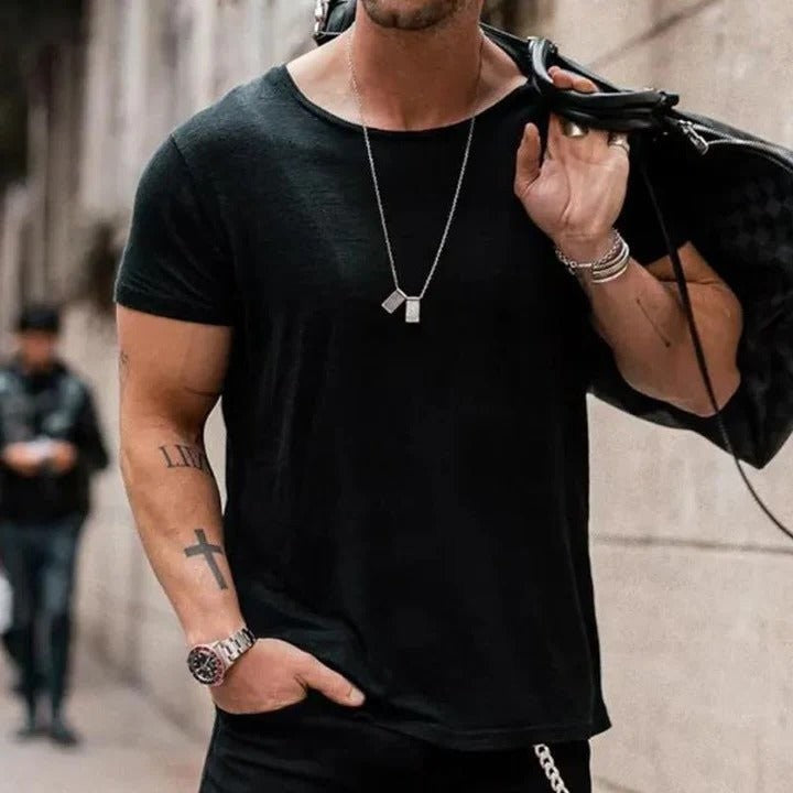 Black round-neck cotton T-shirt styled with layered silver necklaces