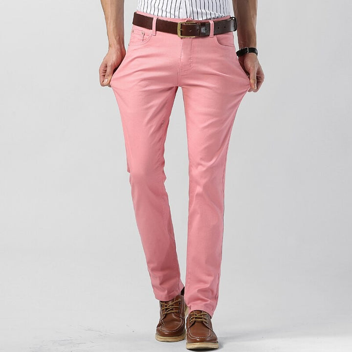 Man modelling pink regular fit chino trousers paired with brown boots