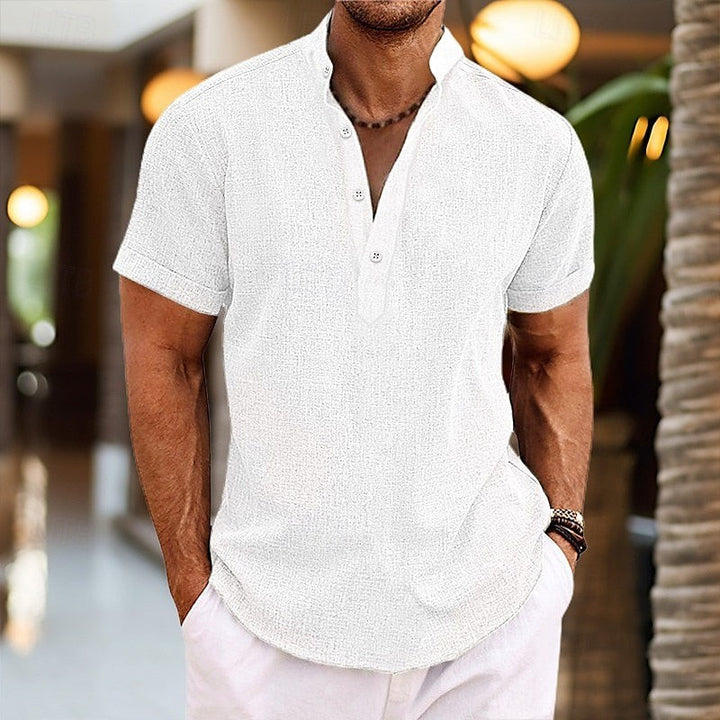 White linen-style short-sleeved shirt featuring a buttoned Grandad collar
