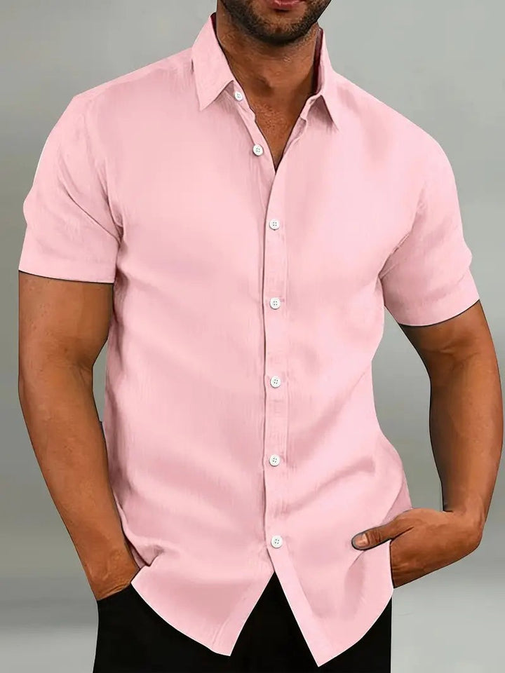 Pink short-sleeve casual shirt with white buttons and collared neckline