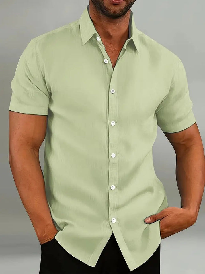 Sage green short-sleeve shirt with classic collar and button fastening