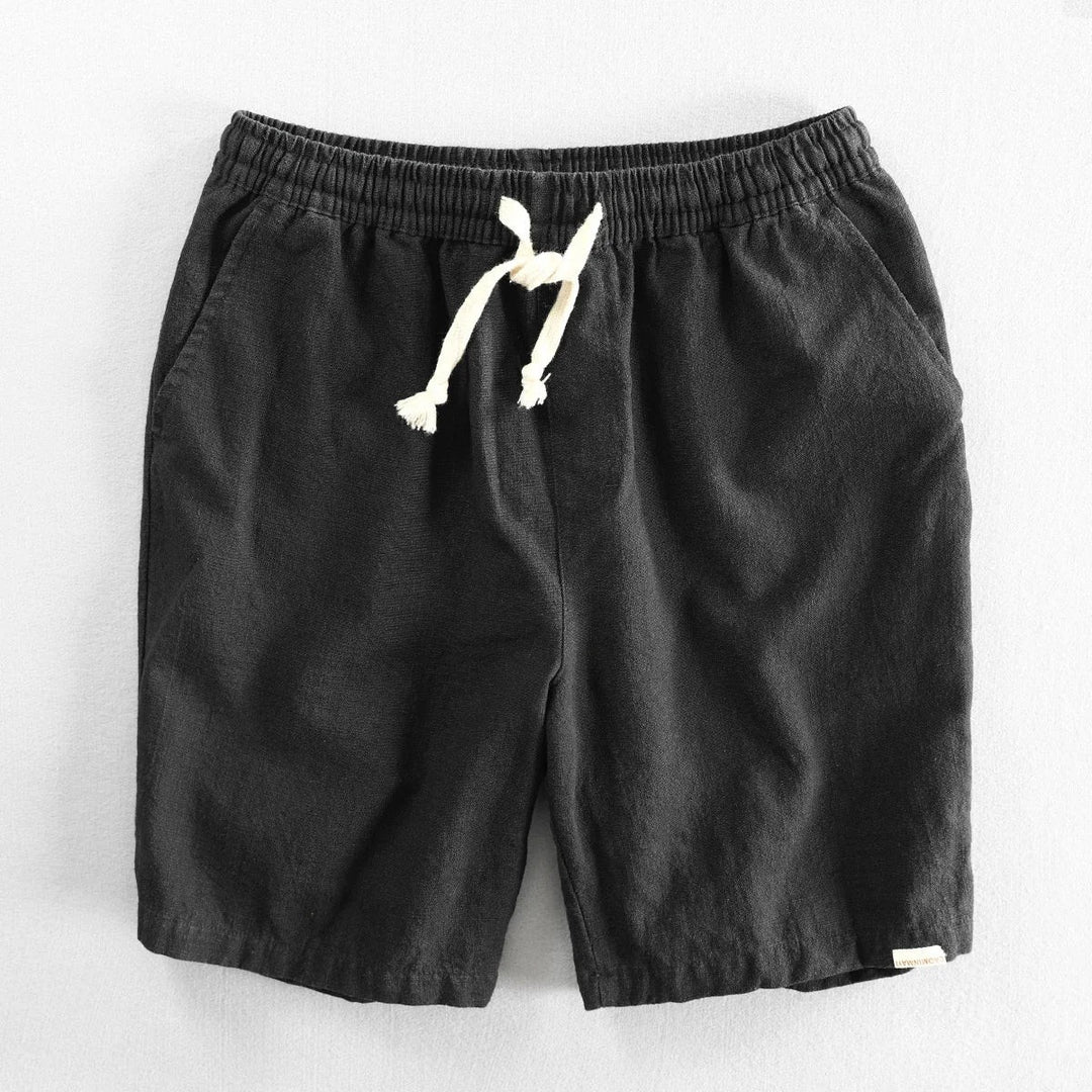 Black linen shorts with elasticated waist and tonal drawstring cord