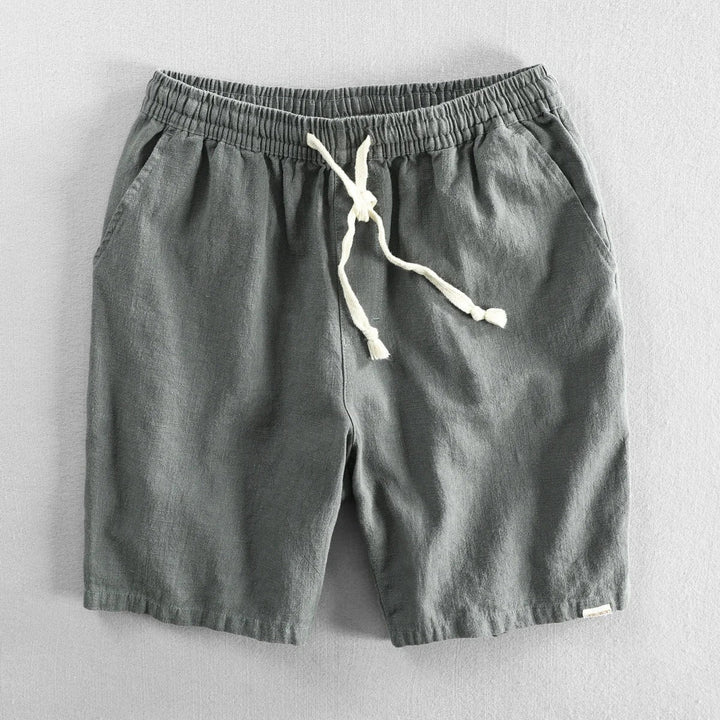 Khaki green linen shorts with drawstring waist and side pocket detail