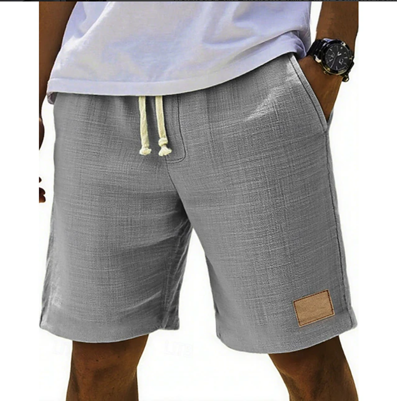 Grey textured linen shorts featuring elasticated drawstring and tan patch