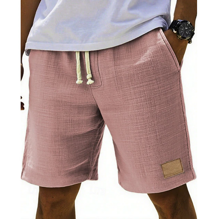 Dusky pink linen-textured shorts with cream drawstring fastening