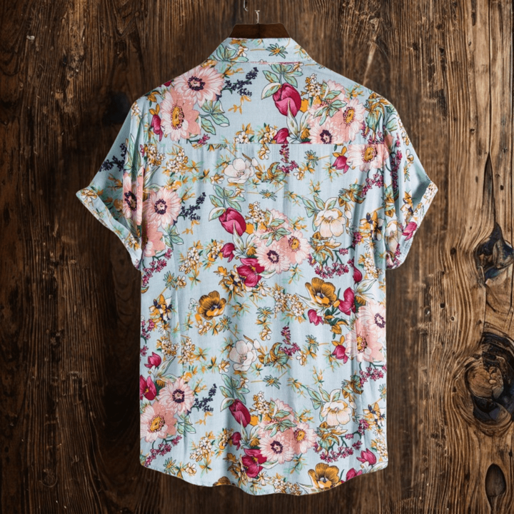 Rear view of men's floral shirt showing full pink and mustard flower print pattern
