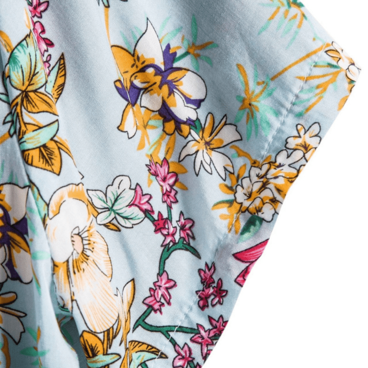 Close-up of sleeve hem showing detailed floral print on lightweight cotton fabric