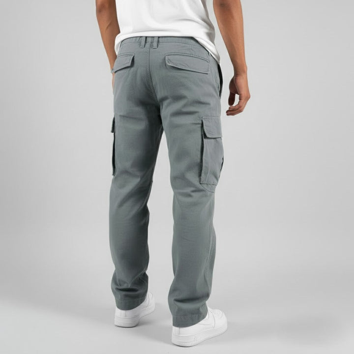 Rear view of grey cargo trousers displaying back pocket design