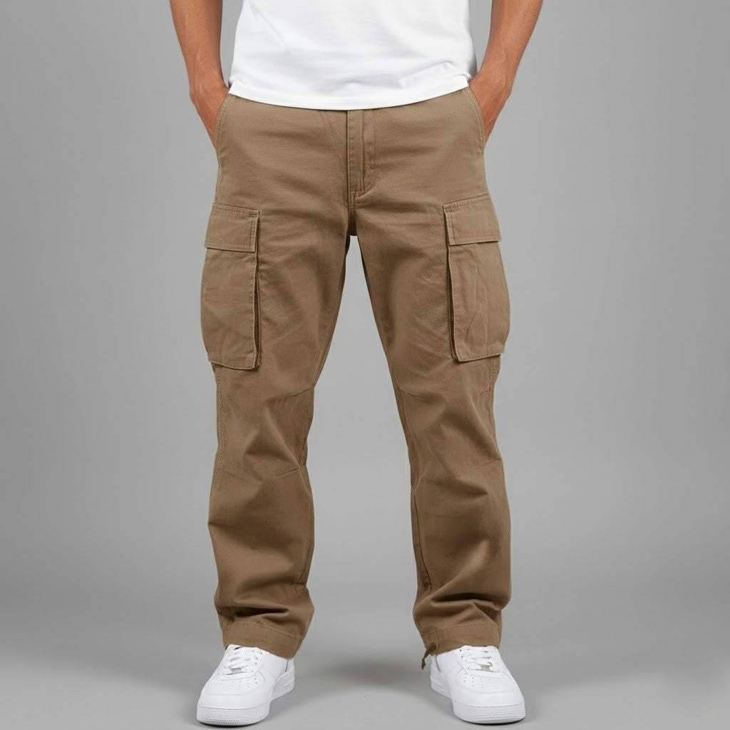 Khaki cargo trousers styled with white trainers, front-on view