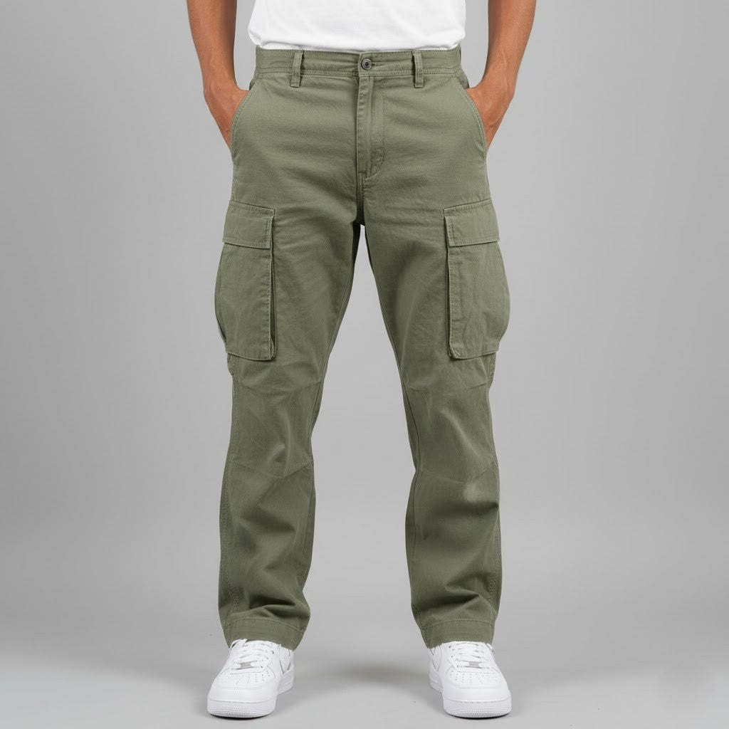 Olive green cargo trousers worn with white trainers, front view