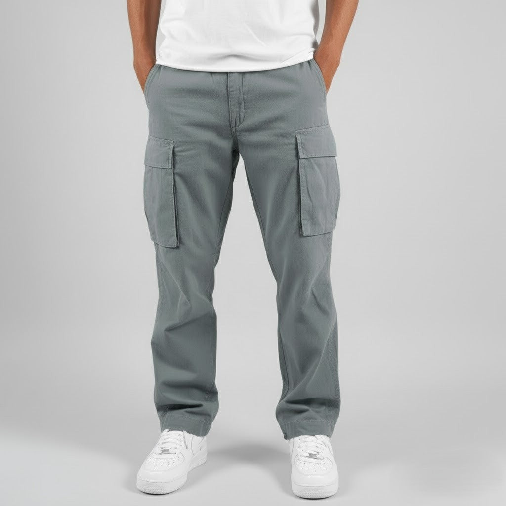 Grey cargo trousers paired with white trainers, front-facing view