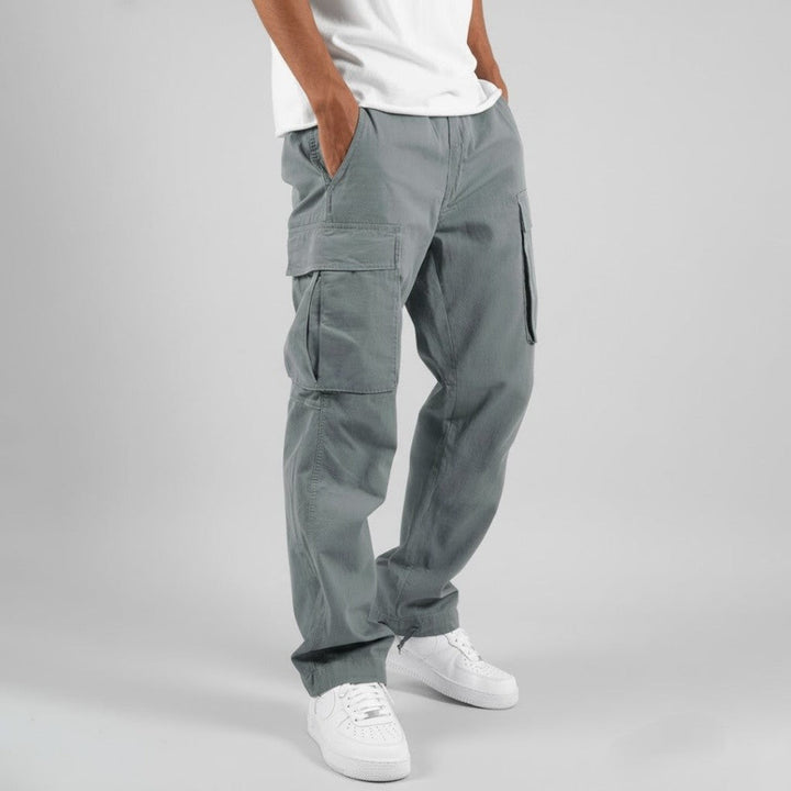 Side view of grey relaxed fit cargo trousers with cargo pocket detail