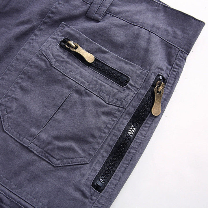 Grey cargo shorts rear pocket detail with twin bronze zip fastenings