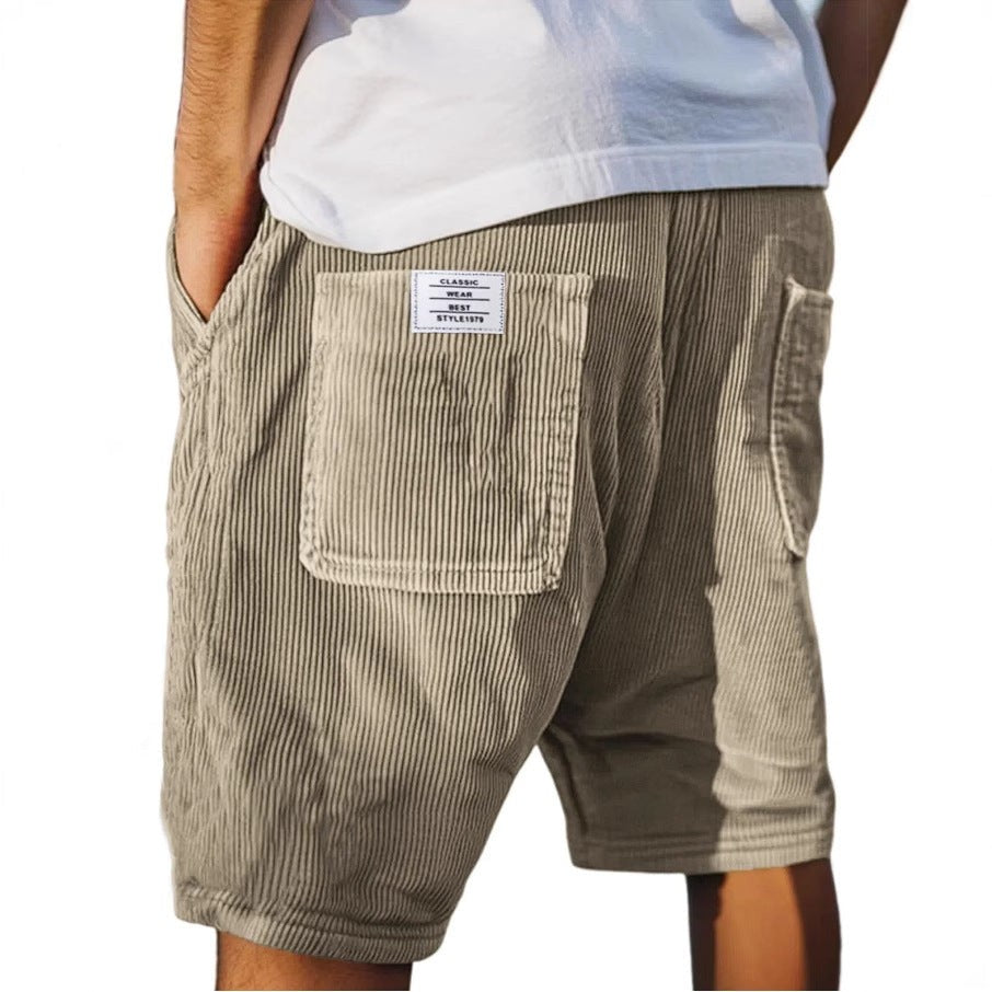 Beige corduroy tailored shorts featuring ribbed texture and rear pocket