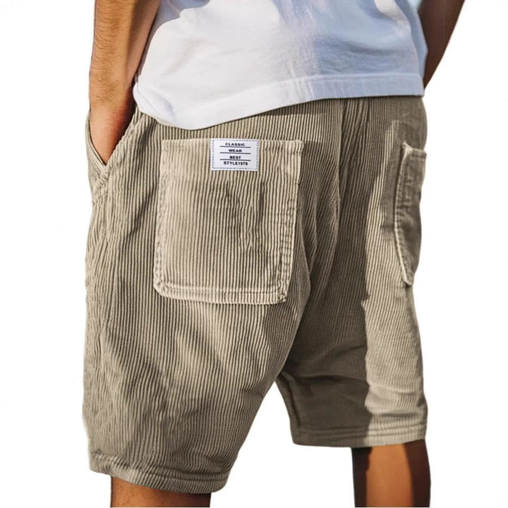 Beige corduroy tailored shorts featuring ribbed texture and rear pocket