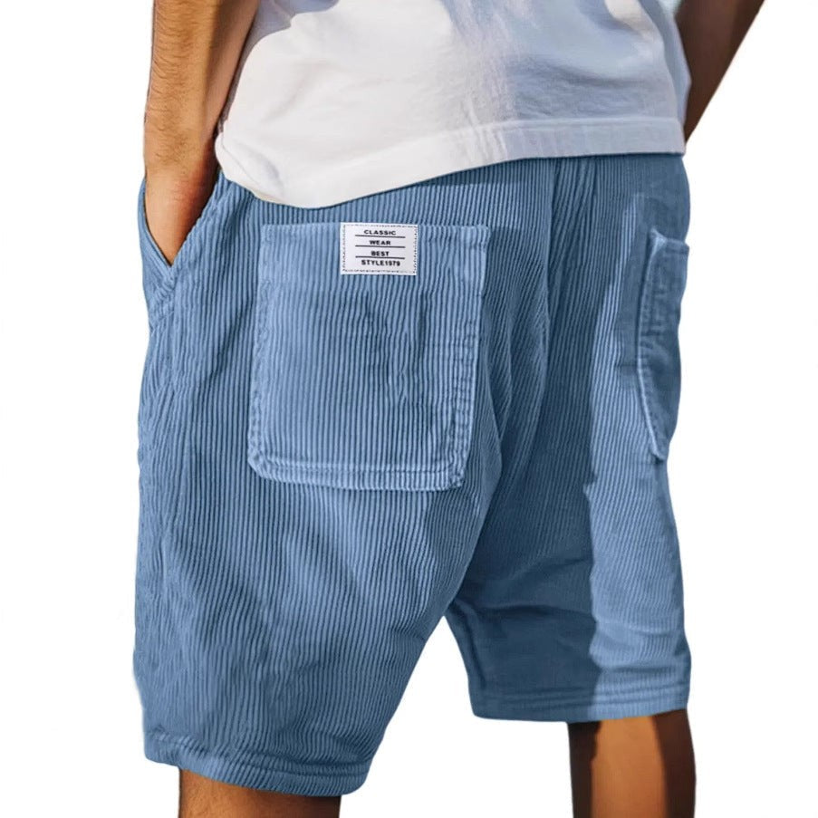 Slate blue corduroy shorts with textured ribbing and patch pocket detail