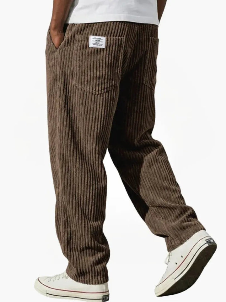 Chocolate brown corduroy trousers with relaxed fit and ribbed texture