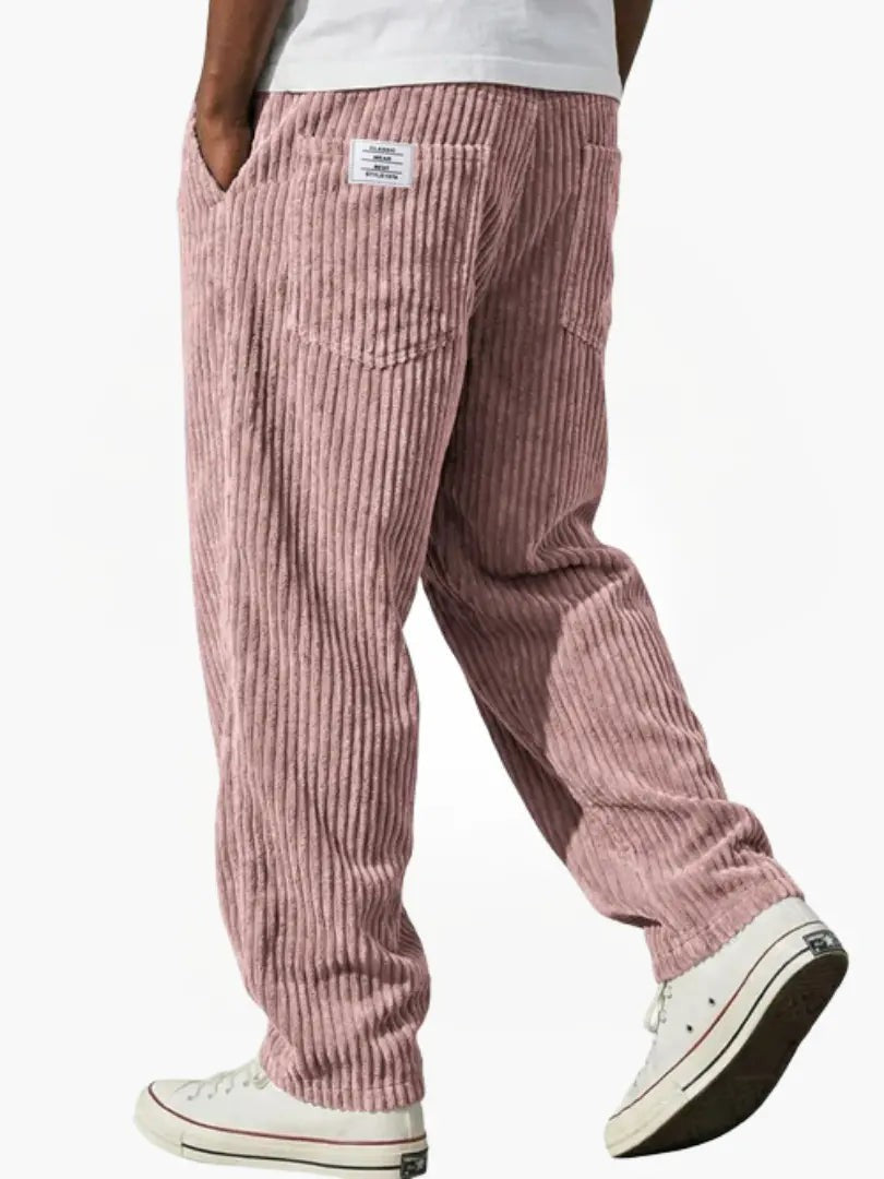 Dusty pink corduroy trousers with wide-leg cut and ribbed texture