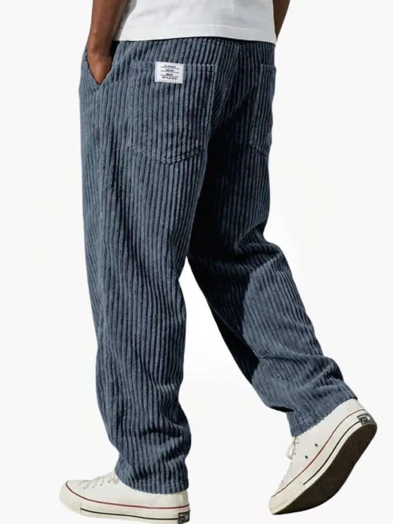 Slate blue corduroy trousers with chunky rib detailing and back pockets