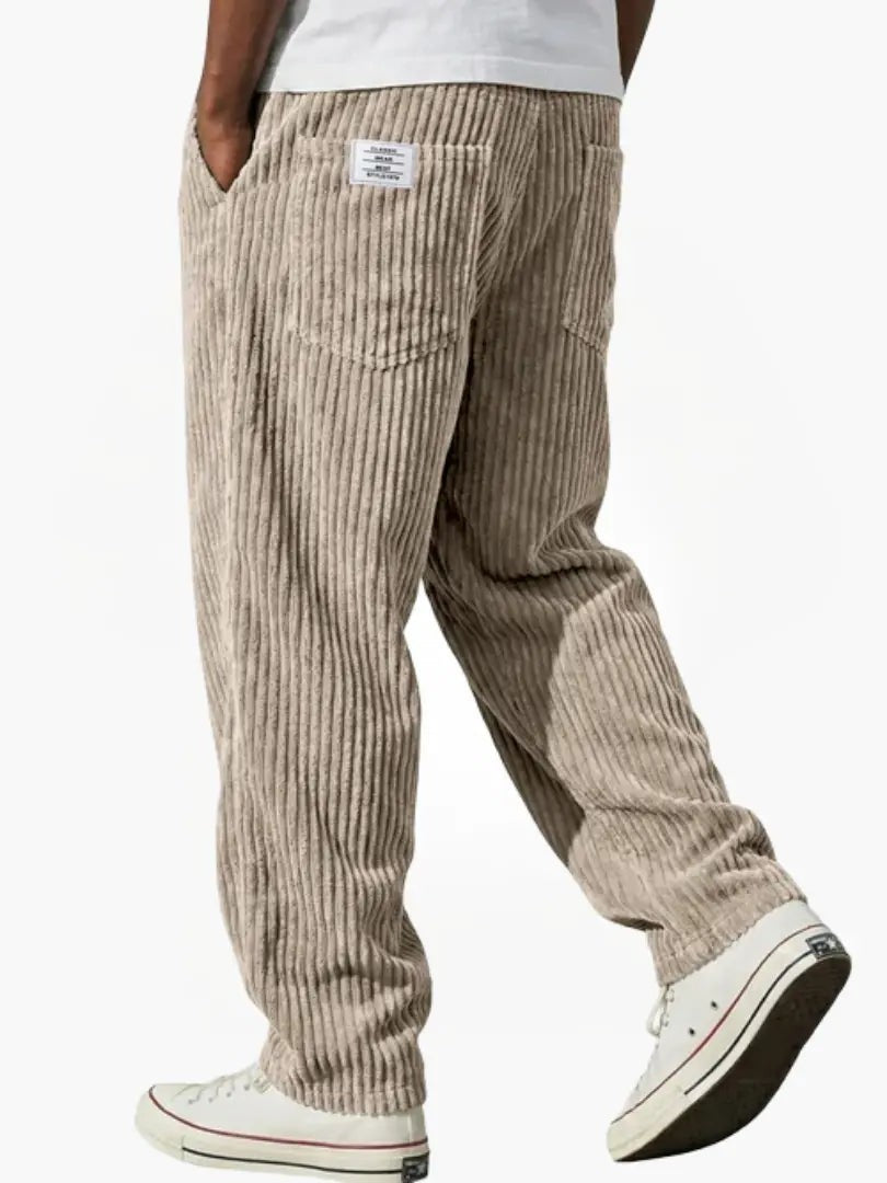 Beige corduroy trousers in a loose, relaxed fit with patch pockets