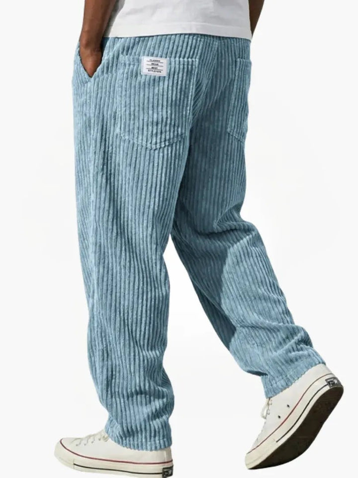 Pale blue corduroy trousers with vintage-style ribbing and back patch