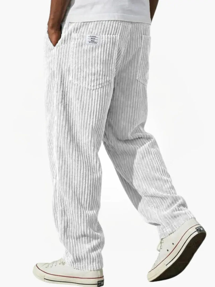White ribbed corduroy trousers with relaxed silhouette and back pockets