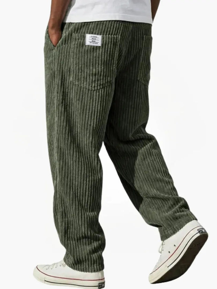 Khaki green corduroy trousers with wide wale texture and patch pocket