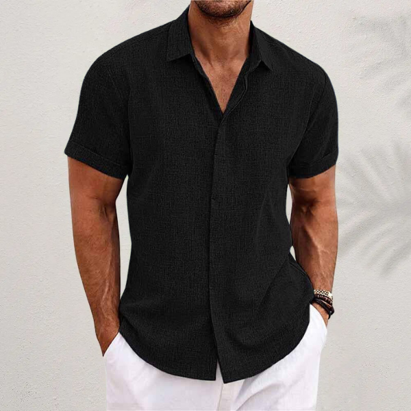 Black textured short-sleeve shirt featuring classic collar and button-up front