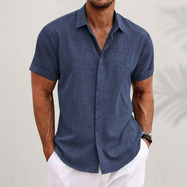 Navy blue textured short-sleeve shirt with classic collar and button placket