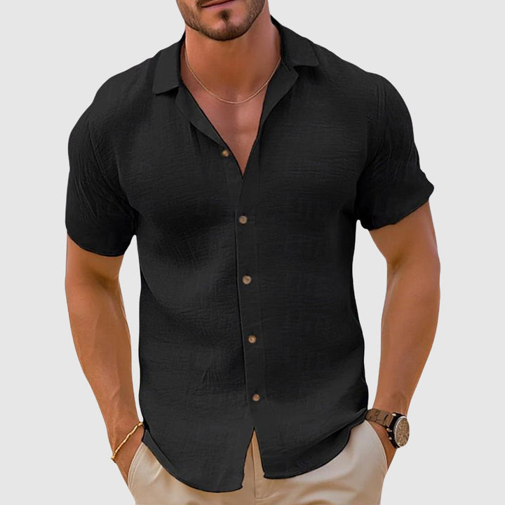 Black short-sleeve button-up shirt with textured linen-style fabric