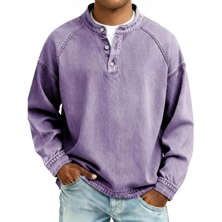Lilac washed denim henley top featuring button neckline and long sleeves