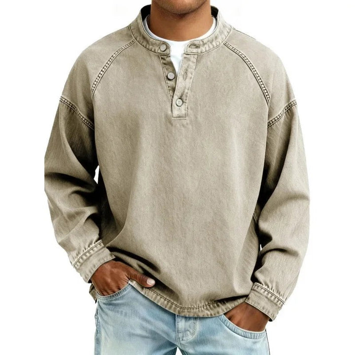 Beige vintage-wash denim henley shirt with button-up neckline