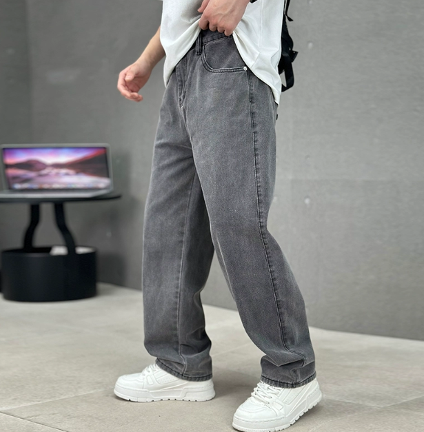Grey wash loose fit straight leg jeans styled with white trainers