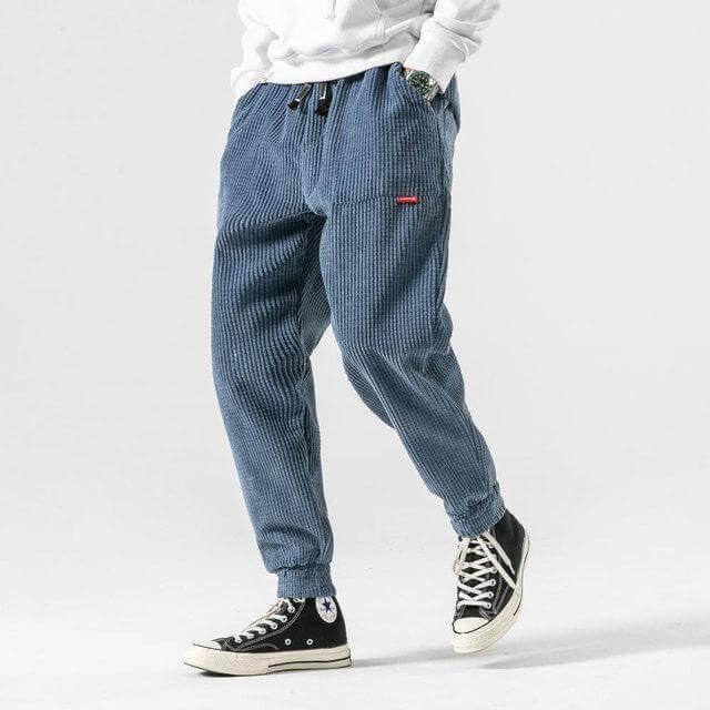 Blue corduroy tapered joggers with drawstring waist and elasticated cuffs
