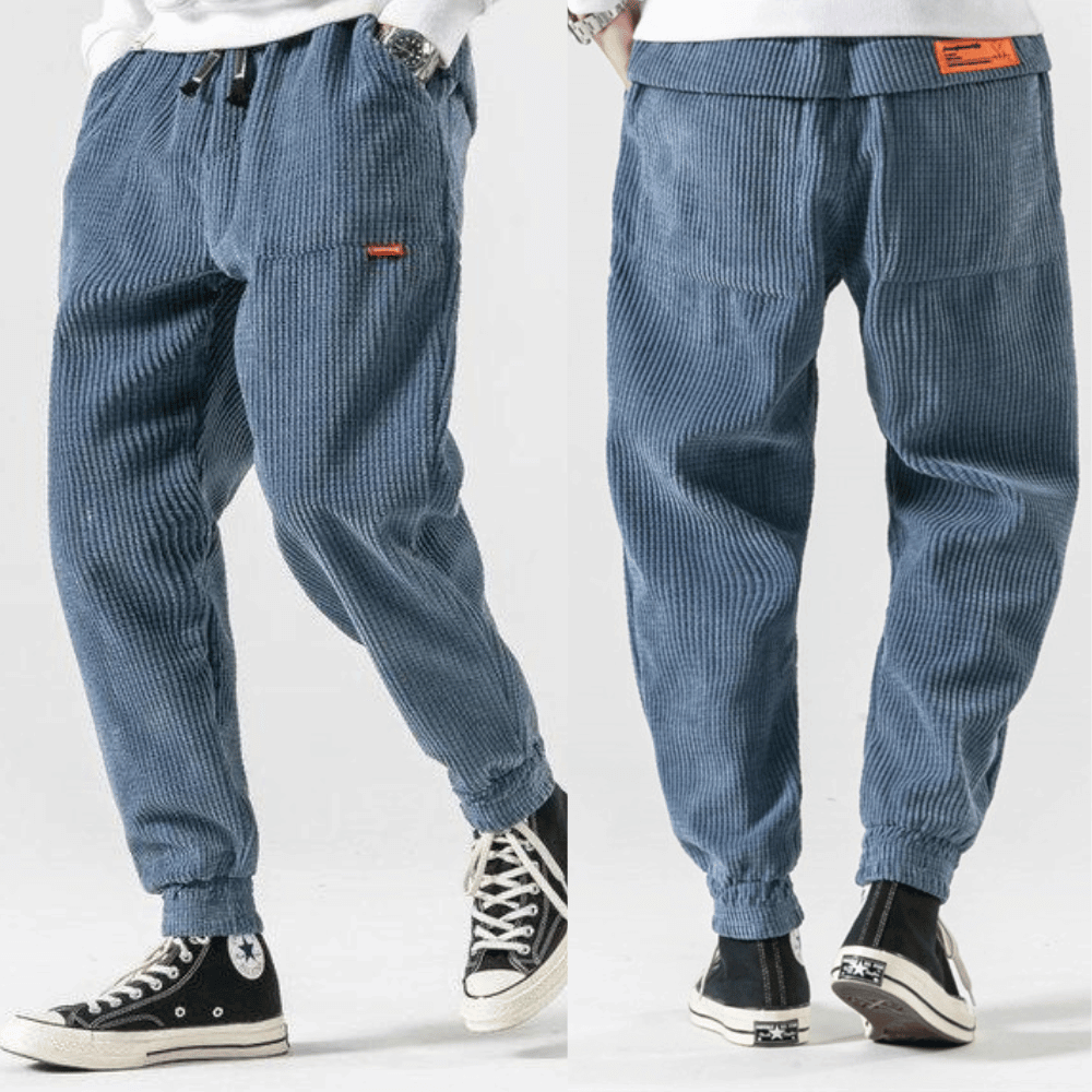 Front and back views of blue corduroy loose fit tapered trousers