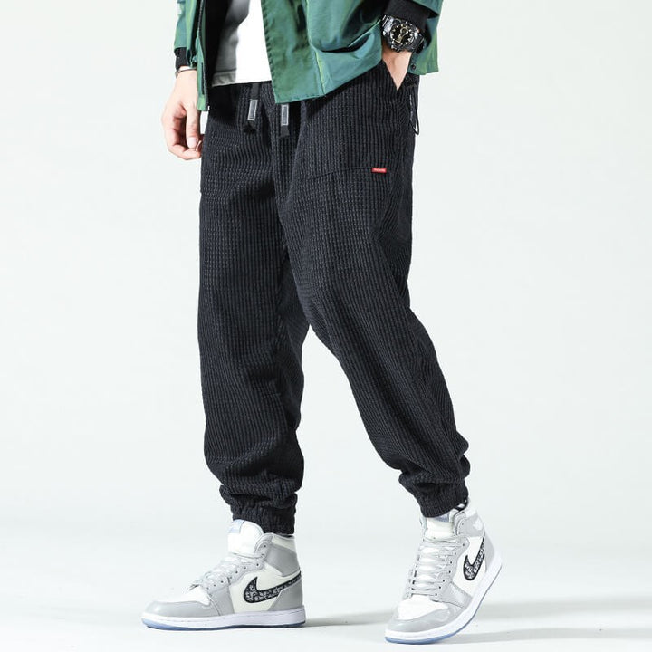 Black corduroy loose fit joggers with drawstring waist and side pocket