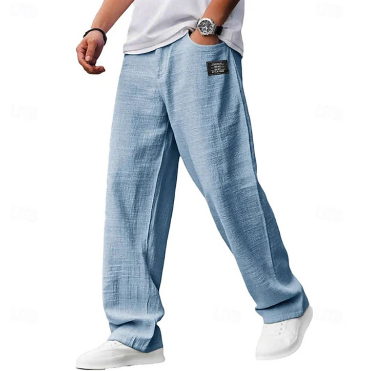 Light blue linen-blend wide-leg trousers styled with white trainers, casual menswear