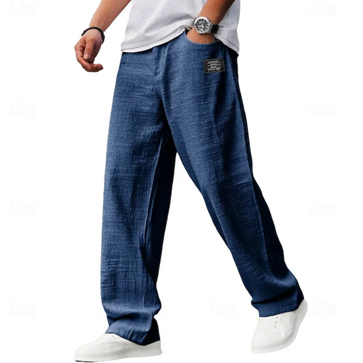 Navy blue linen-blend loose trousers with textured fabric and side pocket detail