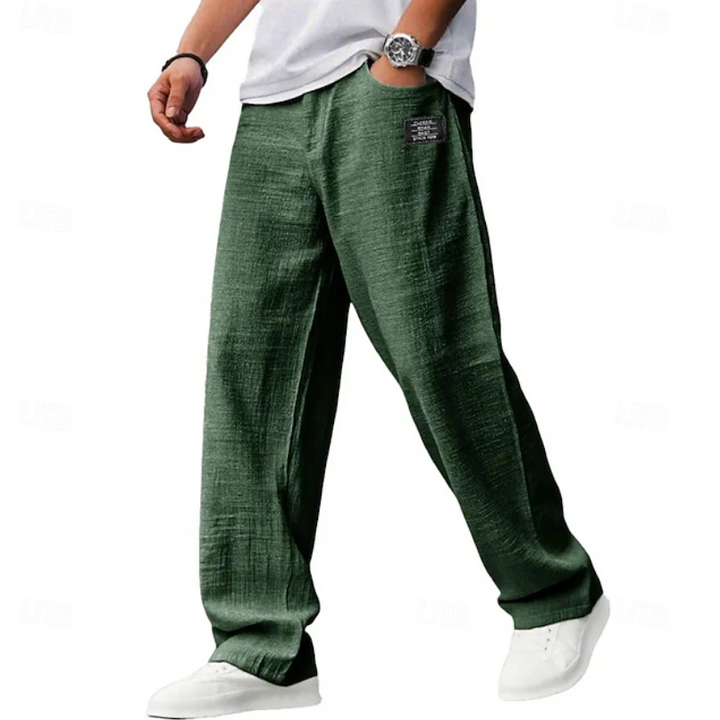 Olive green linen-blend relaxed-fit trousers styled with a plain white t-shirt