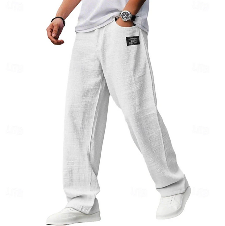 White linen-blend relaxed trousers with elasticated waistband and casual drape