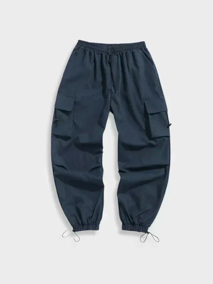 Navy wide-leg cargo trousers with drawstring hems and flap pockets, flat lay