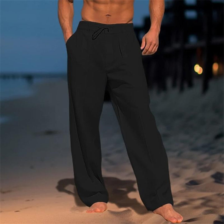 Black wide-leg men's trousers with drawstring waist and tailored pleated front