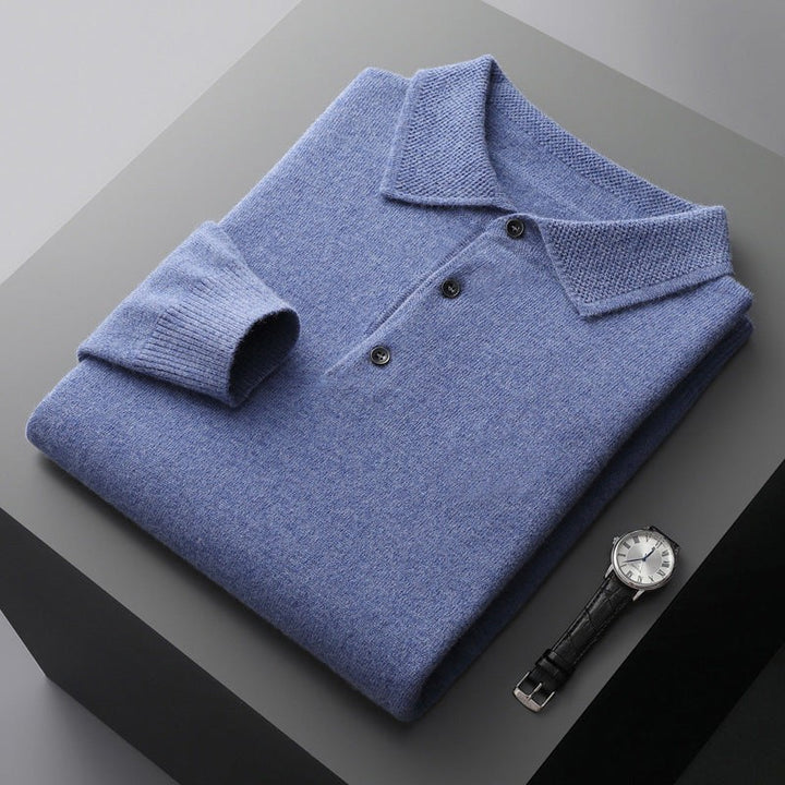 Light blue knitted polo jumper folded neatly with three-button placket