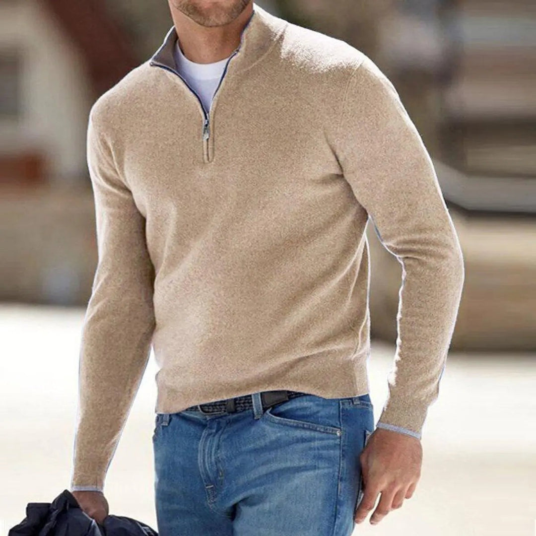 Man wearing beige quarter-zip jumper with contrast collar and jeans